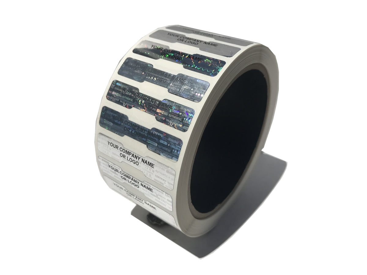 2,000 Silver Tamper Evident Security Hologram Label Seal Sticker, Dogbone 1.75" x 0.375" (44mm x 9mm). CustomPrinted. >Click on item details to Customize.