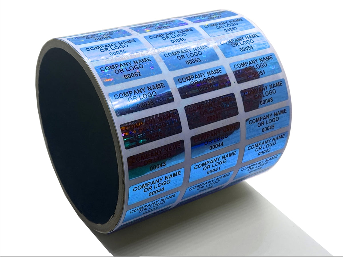 1,000 Blue Tamper Evident Security Holographic Label Seal Sticker, Rectangle 1" x 0.5" (25mm x 13mm). CustomPrinted. >Click on item details to Customize.