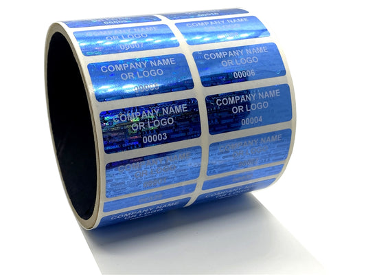 1,000 Blue Tamper Evident Security Hologram Label Seal Sticker, Rectangle 1.5" x 0.6" (38mm x 15mm). CustomPrinted. >Click on item details to Customize.