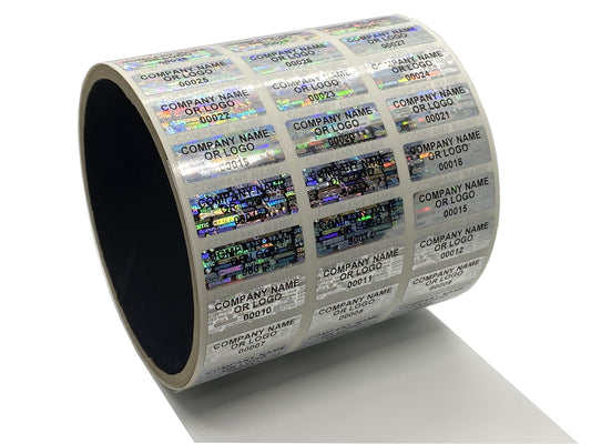 1,000 Silver Tamper Evident Security Holographic Label Seal Sticker, Rectangle 1" x 0.5" (25mm x 13mm). CustomPrinted. >Click on item details to Customize.