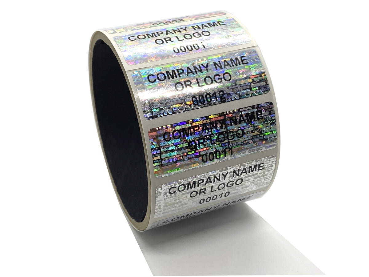10,000 Silver Tamper Evident Security Holographic Label Seal Sticker, Rectangle 2" x 1" (51mm x 25mm). CustomPrinted. >Click on item details to Customize.